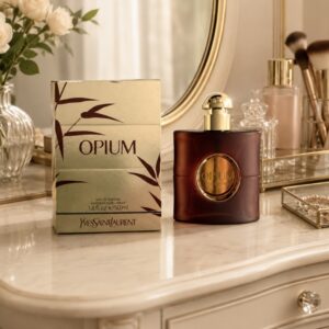 Bottle of YSL opium perfume and the box on a dressing table