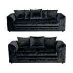 A three seater and a 2 seater black velvet sofas