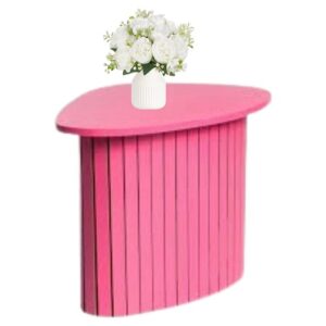 hot pink side table with white vase of flowers on top