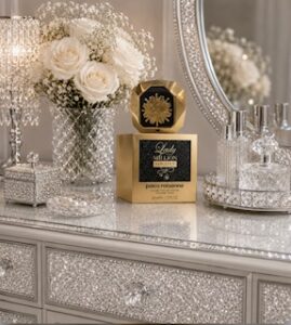 Bottle of Paco Rabbane Lady Million Fabulous Perfume on top of its box on a dressing table with a vase of flowers