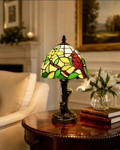A Cardinal Tiffany lamp on a table in a room