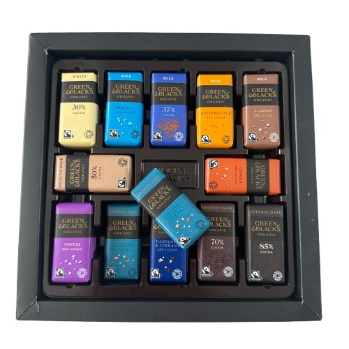 A box of Green and Blacks chocolates showing the open box of chocolates